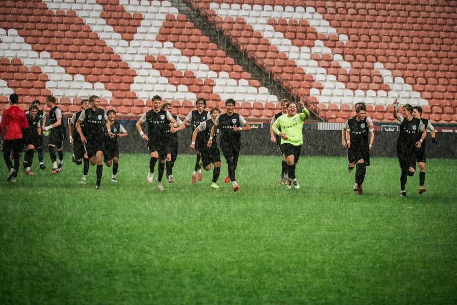 All together. Fire FC boys celebrate at the State Cup final.